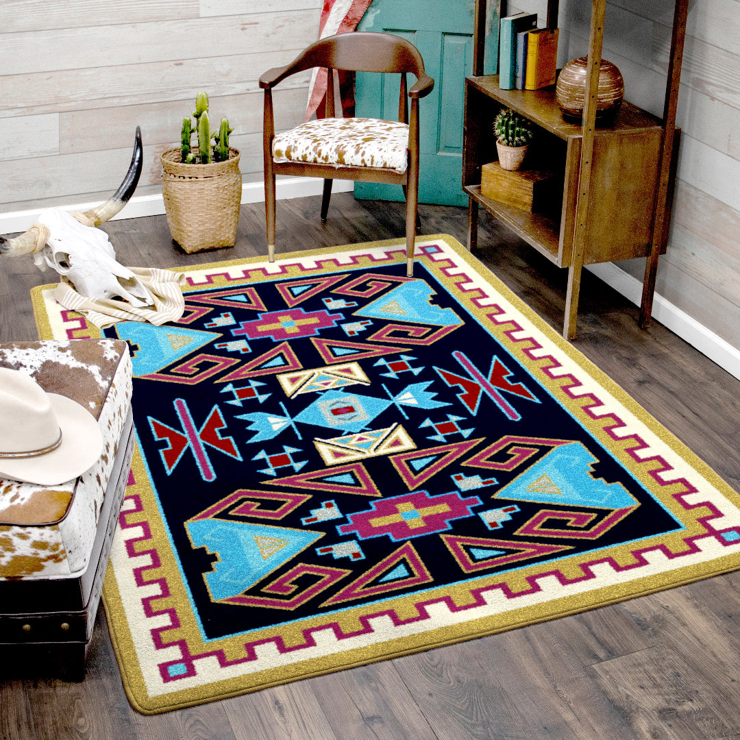 Decorative rug with geometric pattern on a wooden floor in a room setting.
