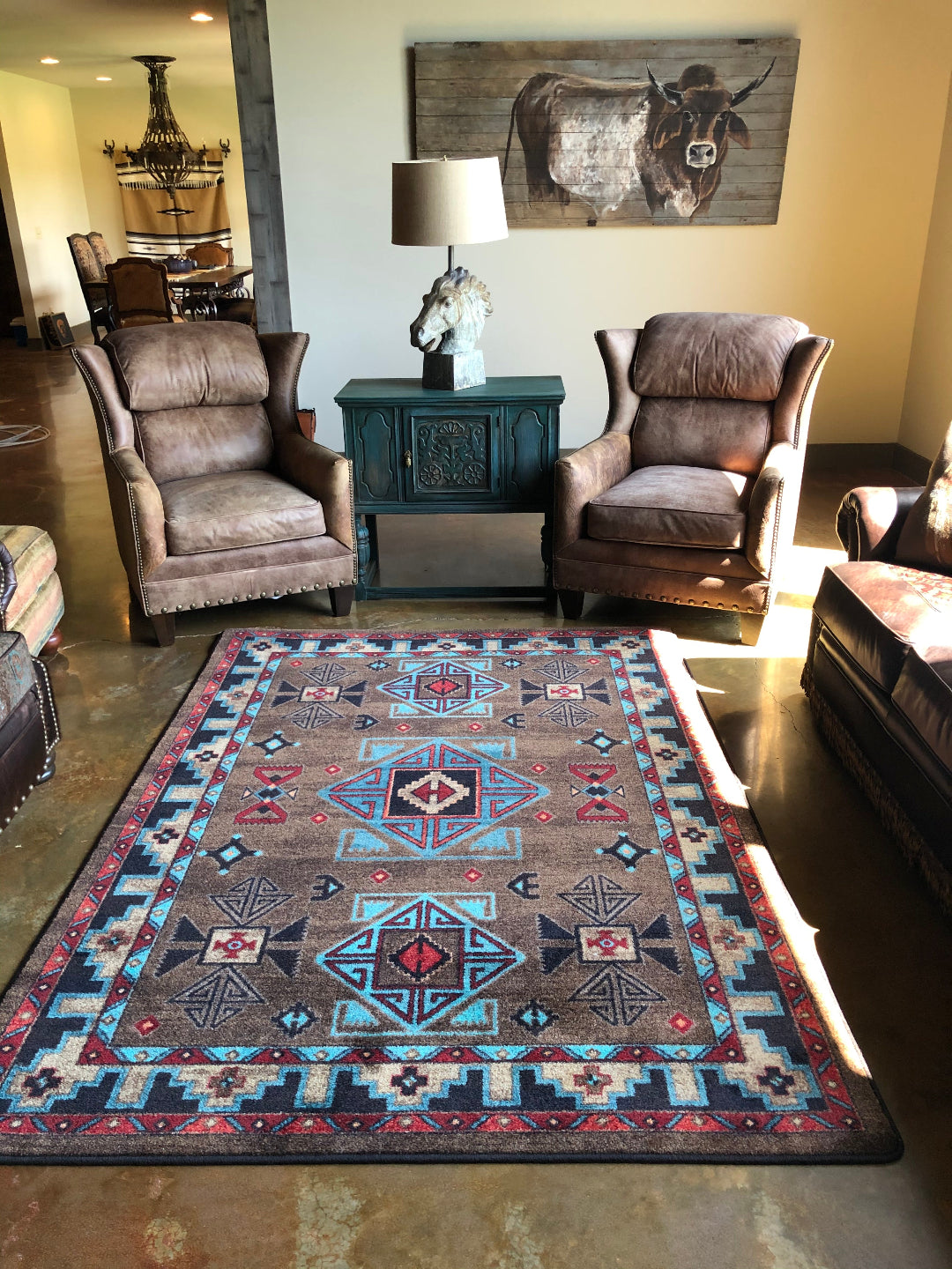 Living room with patterned rug, armchairs, and decorative elements.