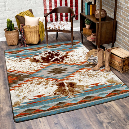 Rug with a cow print design in a room with a chair, boots, and decorative items.